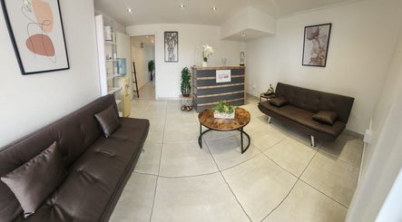 Chic reception area at Pink Orchard Aesthetics in Cape Town, Western Cape, ZA with modern decor.