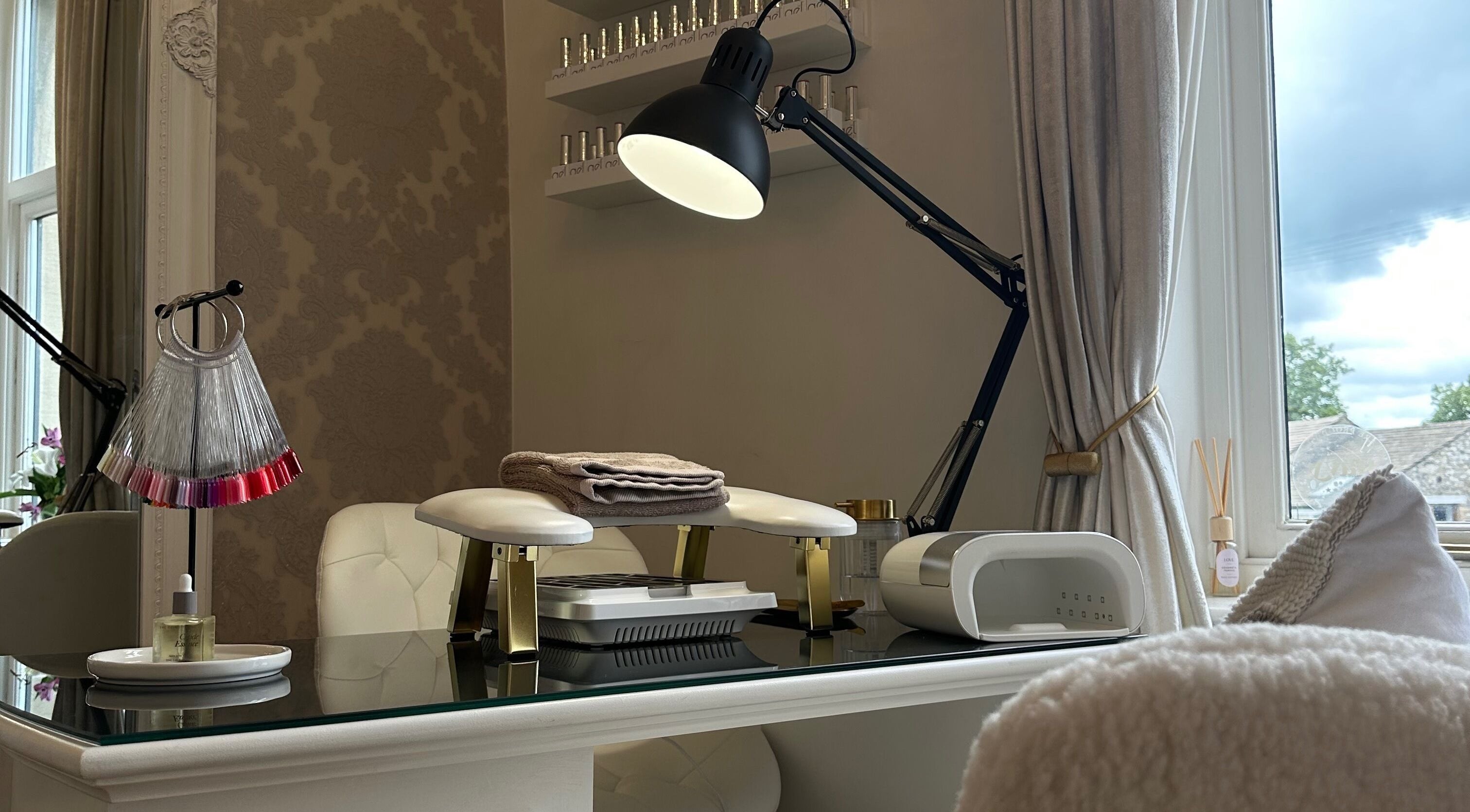 Nail treatment setup at The Essence Of Beauty in Chatburn, England, GB, showcasing modern and cozy decor.