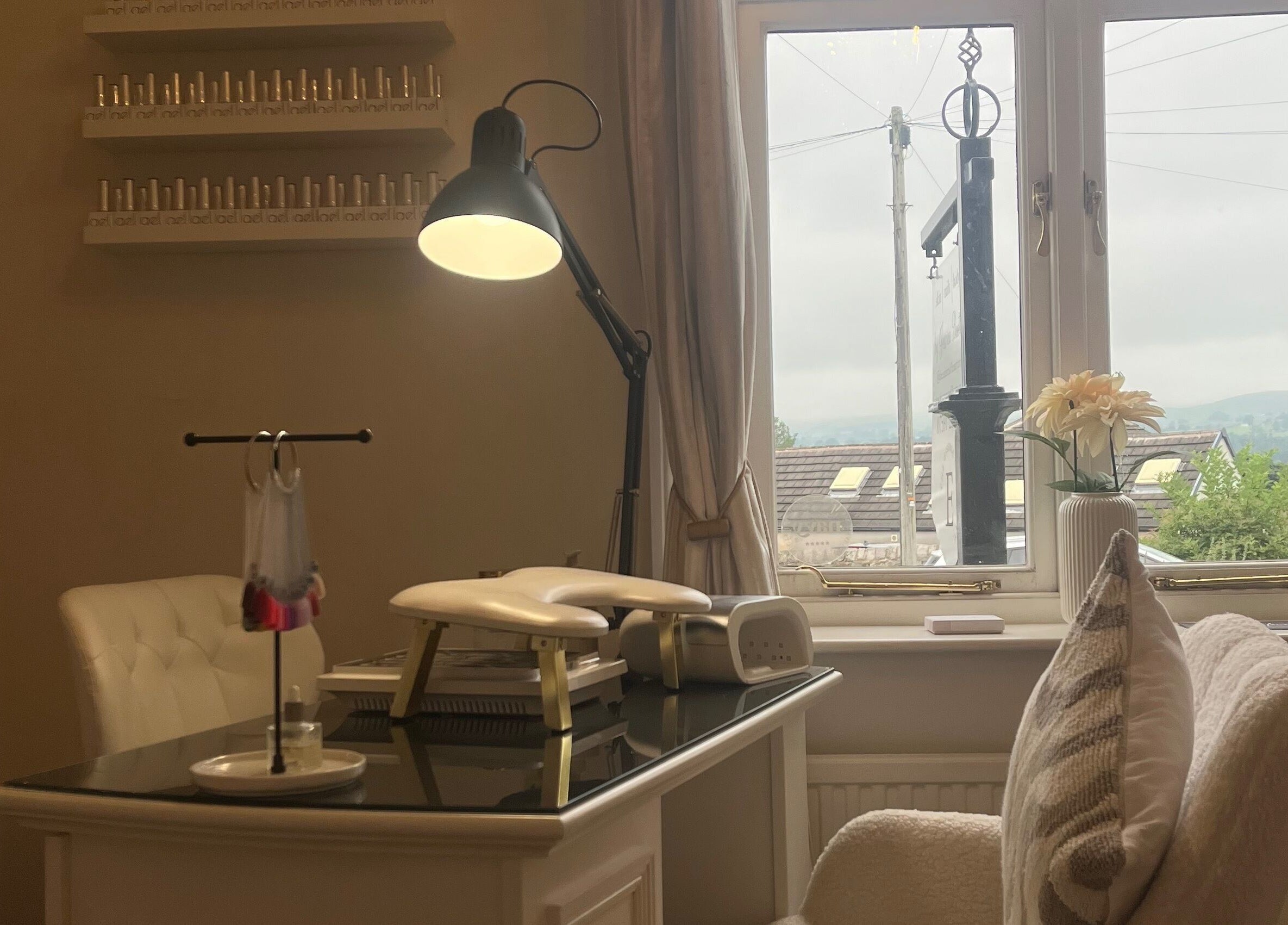 Cozy nail station at The Essence Of Beauty, Chatburn, England, GB, featuring elegant decor and manicure tools.