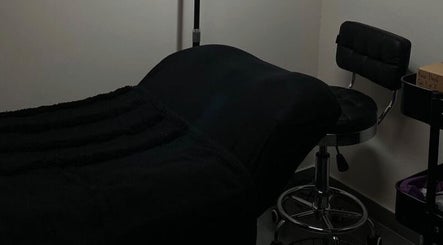 Cozy treatment room with plush seating at Kora beauty studio, Calgary, Alberta, CA.