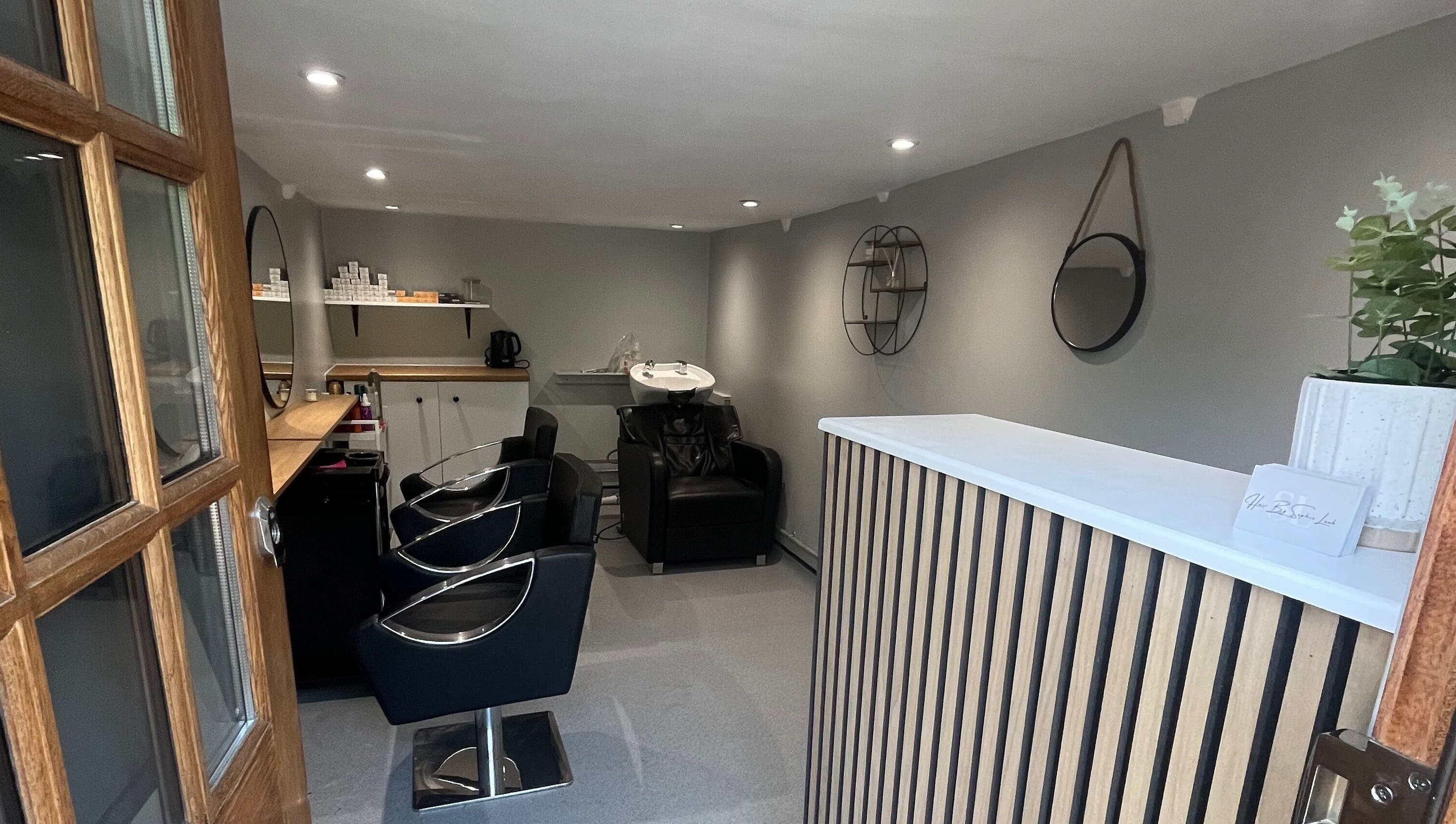 Chic salon interior at Hair By Sophie Leah, Fifield, England, GB offers a welcoming and modern space for clients.