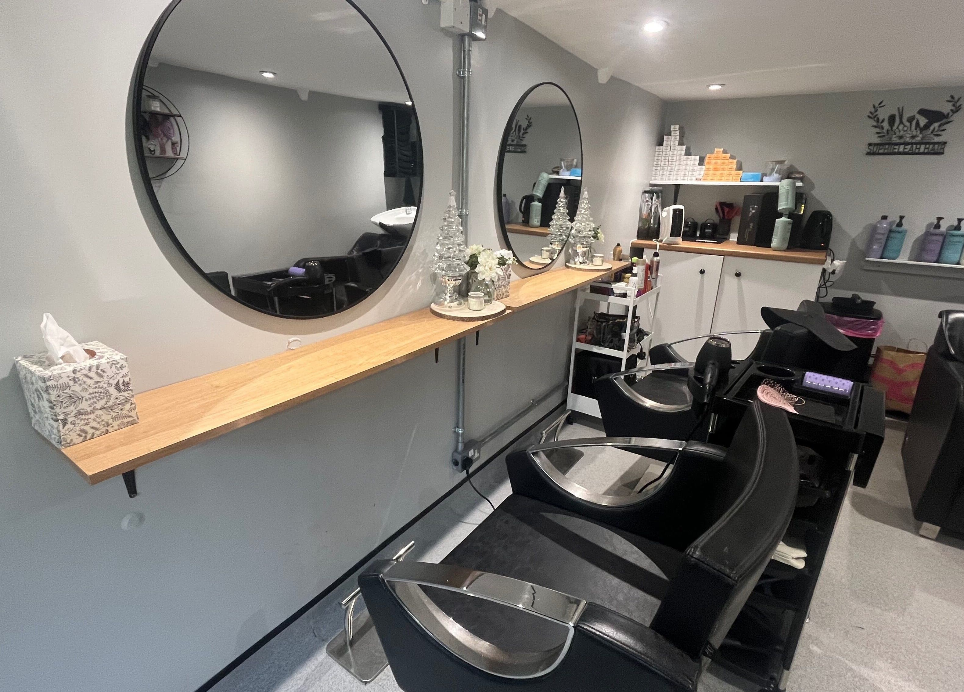 Elegant salon interior at Hair By Sophie Leah in Fifield, England, GB featuring stylish mirrors and seating.