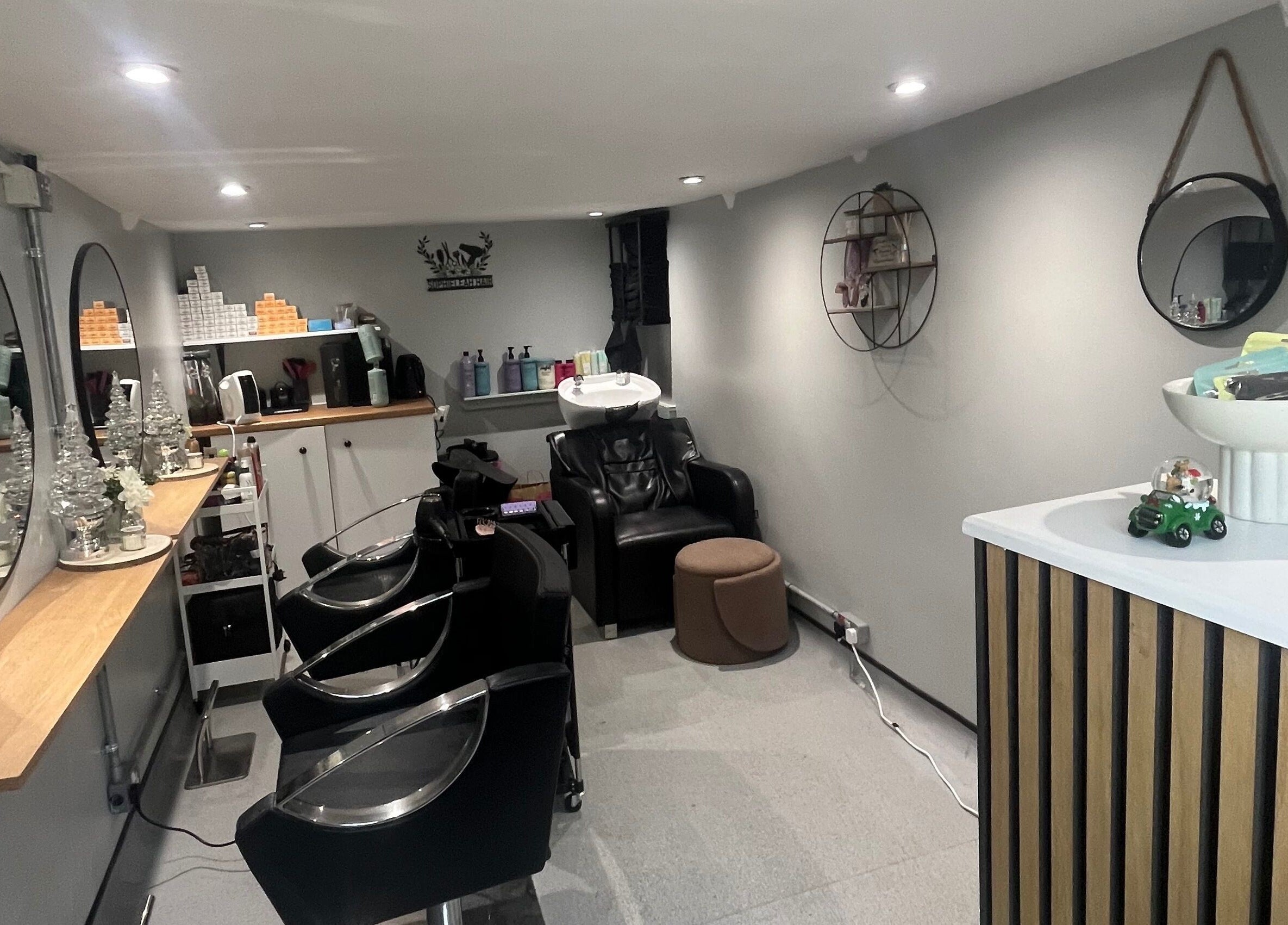 Modern interior of Hair By Sophie Leah in Fifield, England, GB showcasing stylish salon chairs and mirrors.