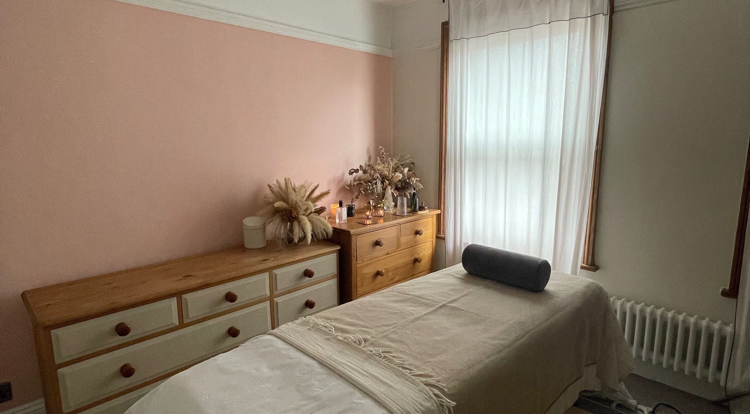 Serene treatment room at Flow.S.Beauty Studio, Ash Vale, England, GB with soft lighting and cozy decor.