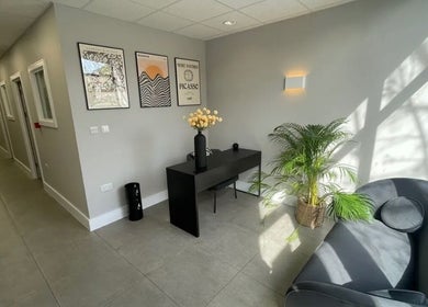 Modern reception area at Aesthetics by Katrina, London, England, GB with chic seating and elegant decor.