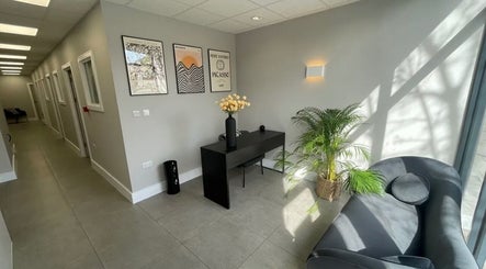 Modern reception area at Aesthetics by Katrina, London, England, GB with chic seating and elegant decor.