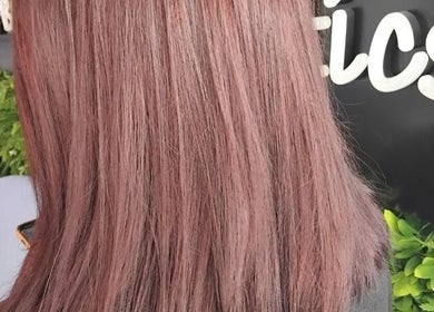 Close-up of rosy pink hair at Emma Hair, Liverpool, England, GB, showcasing vibrant color and smooth texture.