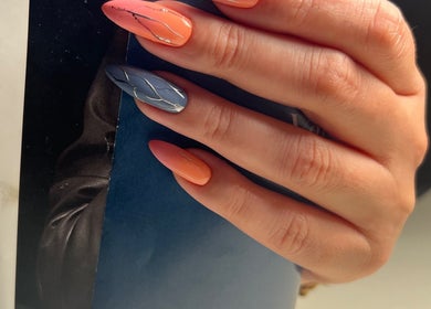 Hand showcasing vibrant nail art at Nails by Ilona, Chicago, United States, US. Metallic accents enhance the design.