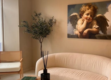 Cozy waiting area with angel painting at Clinic E, Clarkston, Scotland, GB.
