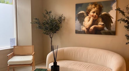 Cozy waiting area with angel painting at Clinic E, Clarkston, Scotland, GB.