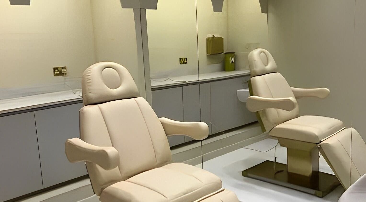 Luxury treatment chairs in Clinic E, Clarkston, Scotland, GB, offering a serene wellness atmosphere.