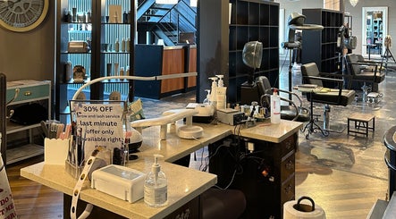 Interior of DZVINKA Beauty Studio in Edmonton, Alberta, CA showcasing modern styling stations and products.