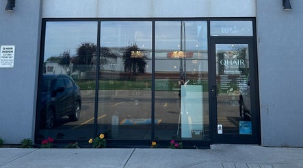 Front entrance of DZVINKA Beauty Studio in Edmonton, Alberta, CA with modern glass facade.