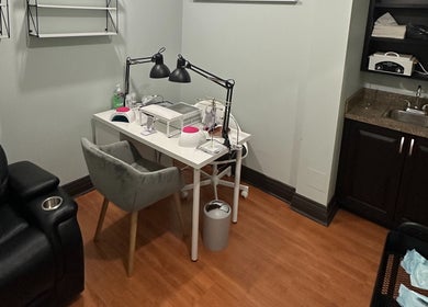 Nail service station at DZVINKA Beauty Studio, Edmonton, Alberta, CA. Comfortable seating and modern tools.