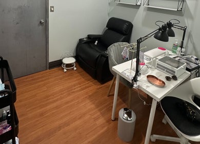 Private nail station at DZVINKA Beauty Studio, Edmonton, Alberta, CA with comfy chairs and manicure tools.