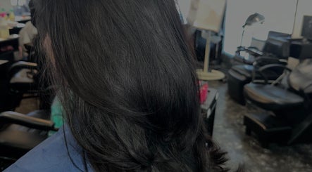 Smooth, shiny black hair at Hevani Touch salon, US, showcasing professional styling.