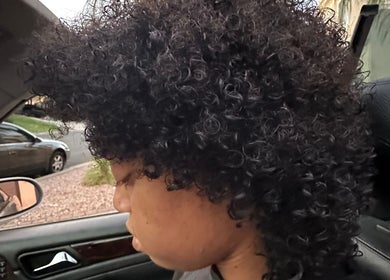 Close-up of curly hair styled at Hevani Touch, Riverside, California, US.