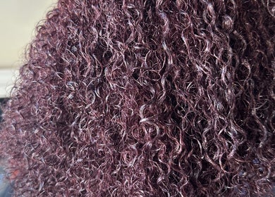 Luxurious curly hair showcased at Hevani Touch, Riverside, California, US.