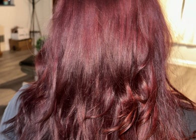 Rich burgundy hair styled beautifully at Hevani Touch, Riverside, California, US.