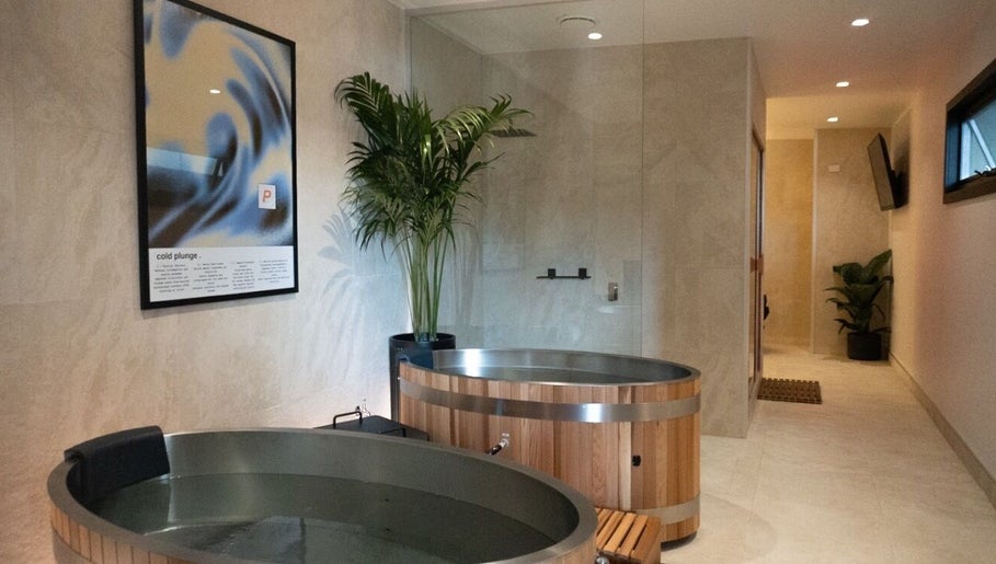 Modern cold plunge room at Paced Recovery in Melbourne, Victoria, AU with wooden tubs and serene decor.