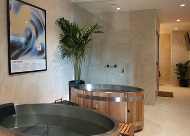 Modern cold plunge room at Paced Recovery in Melbourne, Victoria, AU with wooden tubs and serene decor.