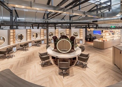 Spacious interior of Koco Hair by Jessicka- Salon Lane West End in West End, Queensland, AU with chic styling stations.