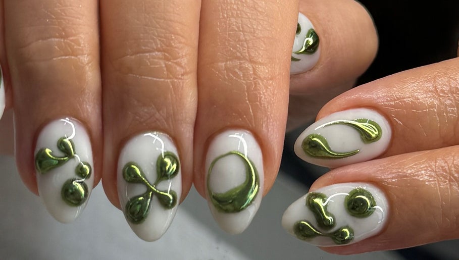 Intricate green nail art on white background at Nailspa, Singapore, SG offering eco-friendly beauty designs.