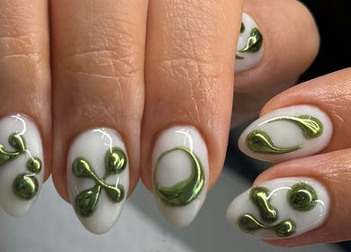 Intricate green nail art on white background at Nailspa, Singapore, SG offering eco-friendly beauty designs.