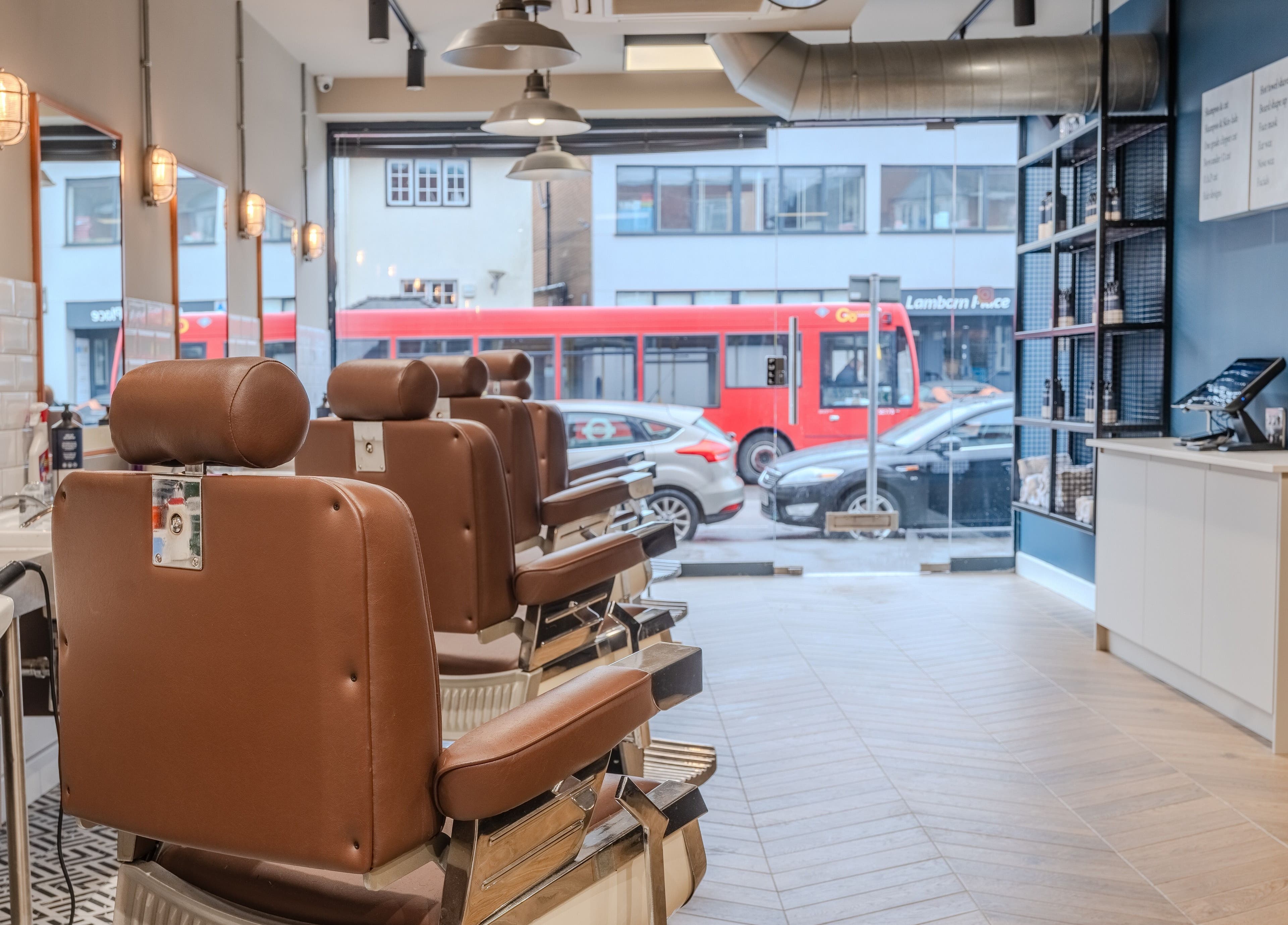 Elegant interior of Sammies Studio - Banstead with vintage barber chairs in Banstead, England, GB.