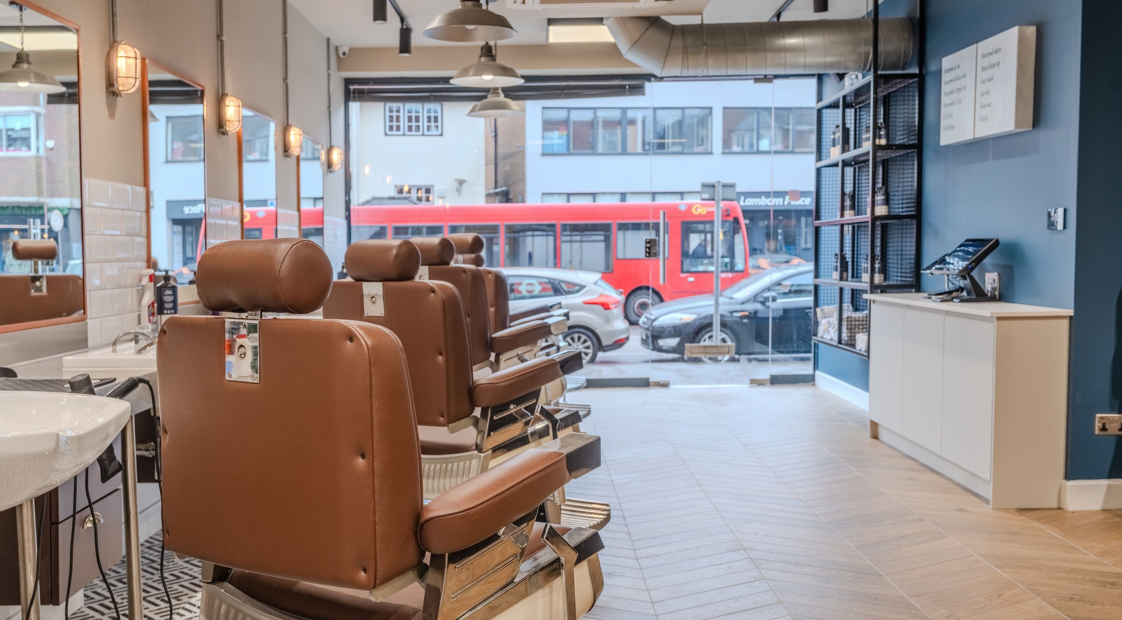 Elegant interior of Sammies Studio - Banstead with vintage barber chairs in Banstead, England, GB.