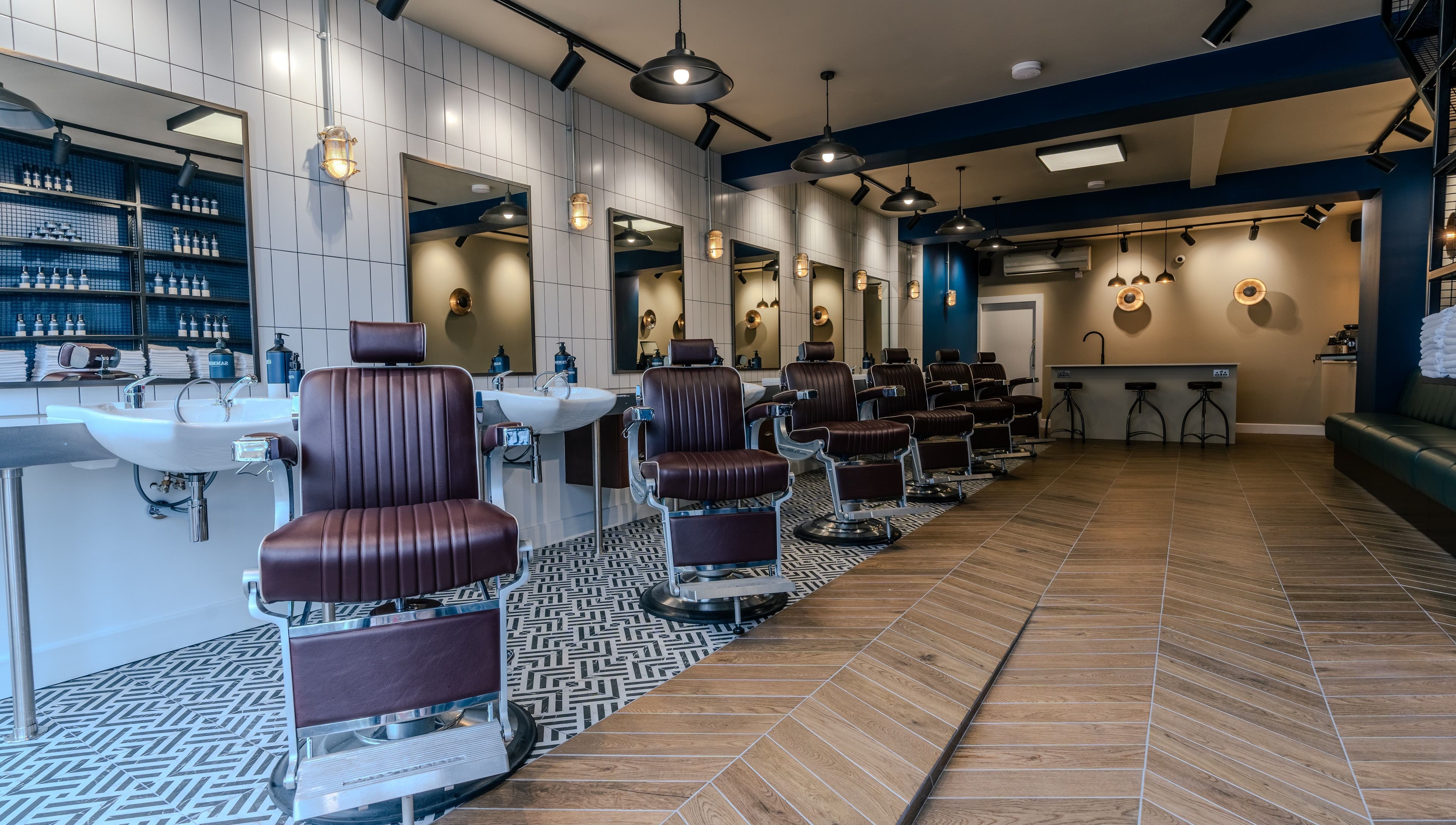 Modern barber chairs at Sammies Studio - Northcote Road, London, England, GB, showcasing a stylish interior.