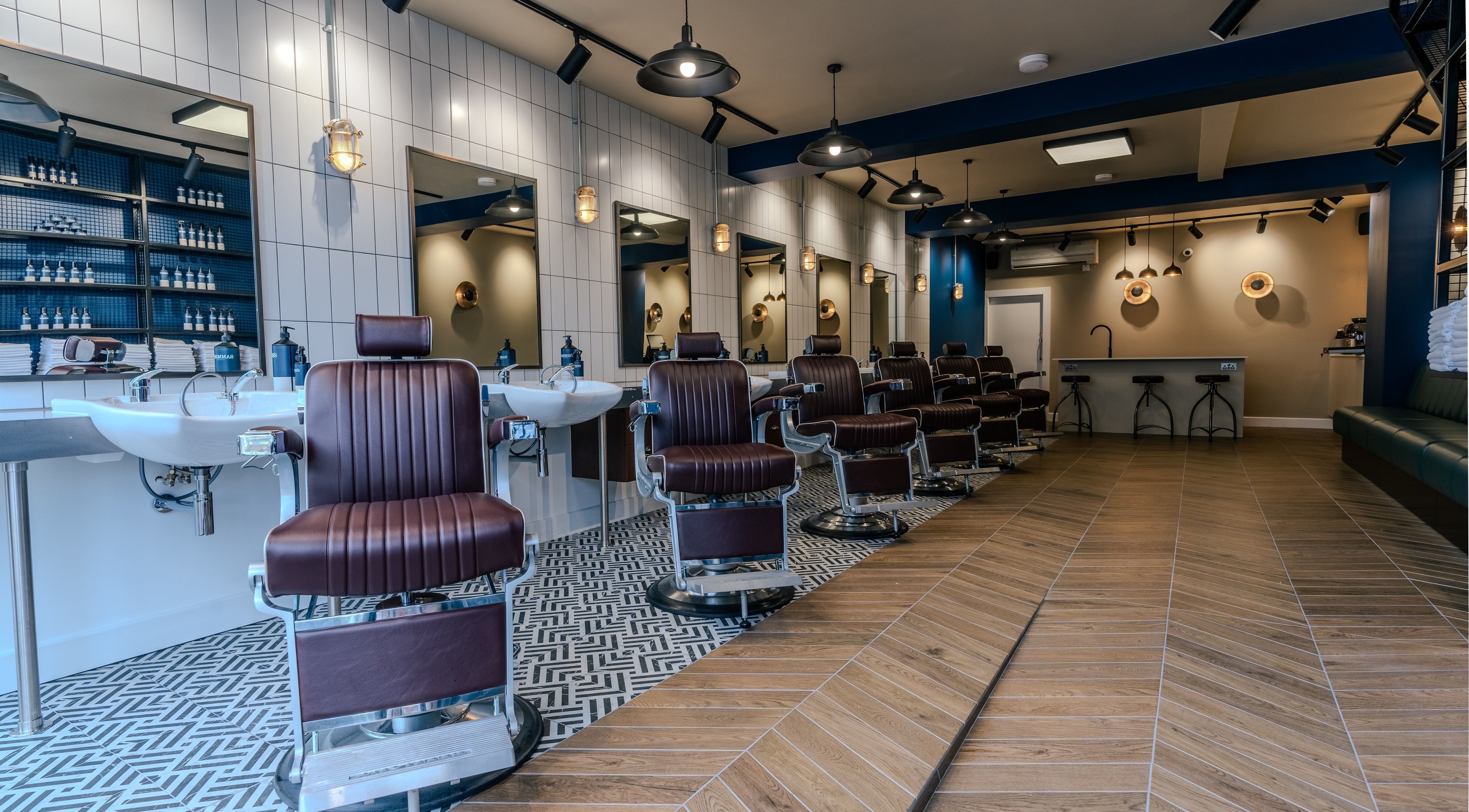 Modern barber chairs at Sammies Studio - Northcote Road, London, England, GB, showcasing a stylish interior.