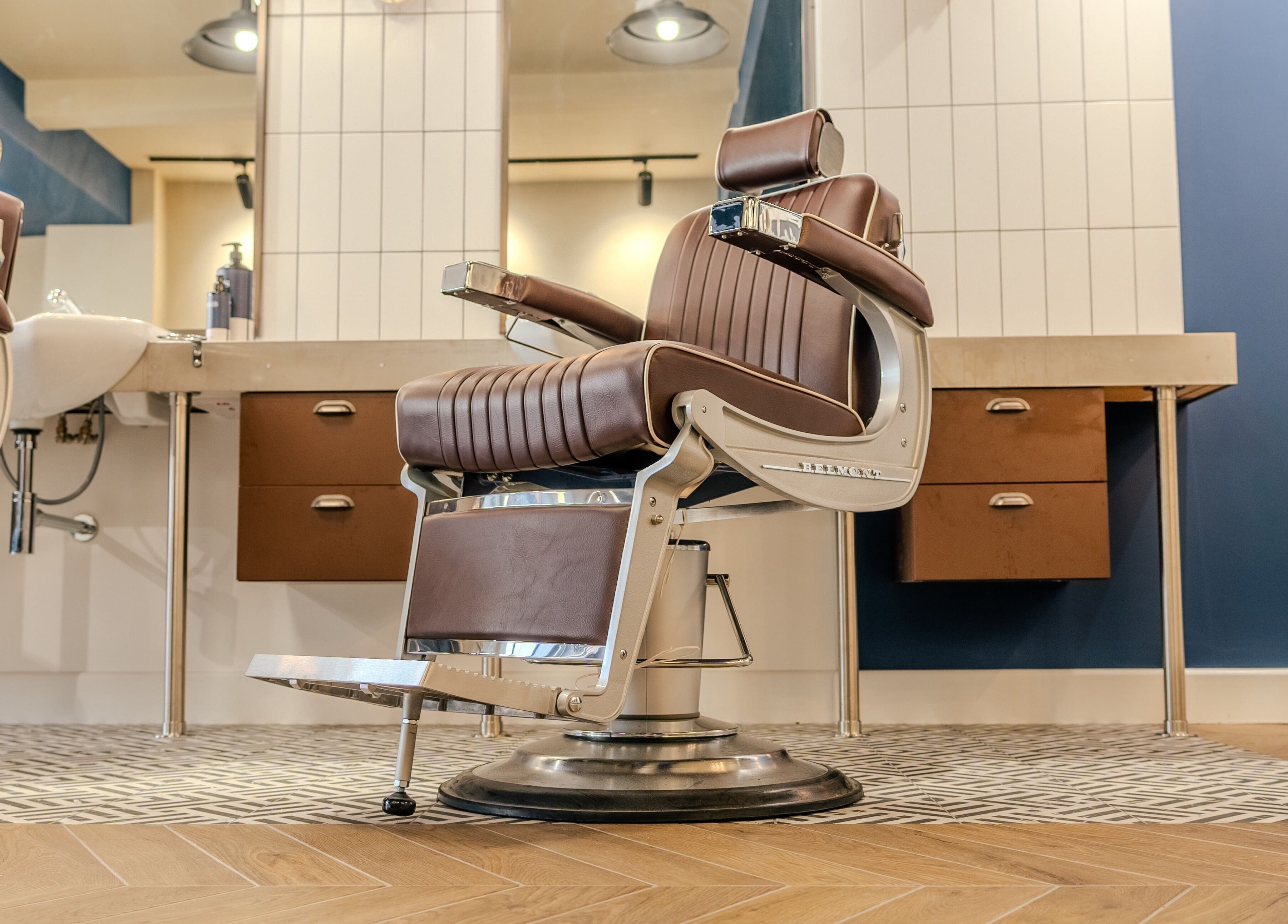 Elegant barber chair at Sammies Studio - Northcote Road, London, England, GB. Modern decor enhances vintage charm.