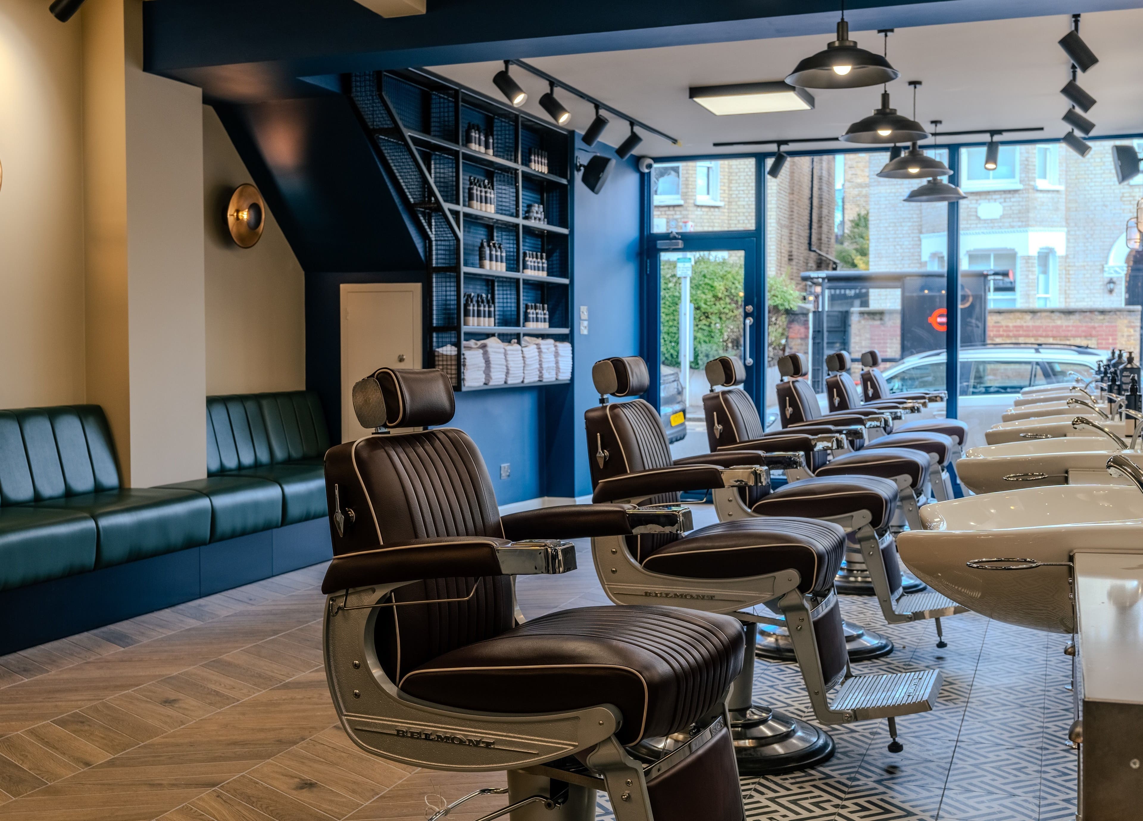 Modern barber chairs in Sammies Studio - Northcote Road, London, England, GB. Stylish and inviting ambience.