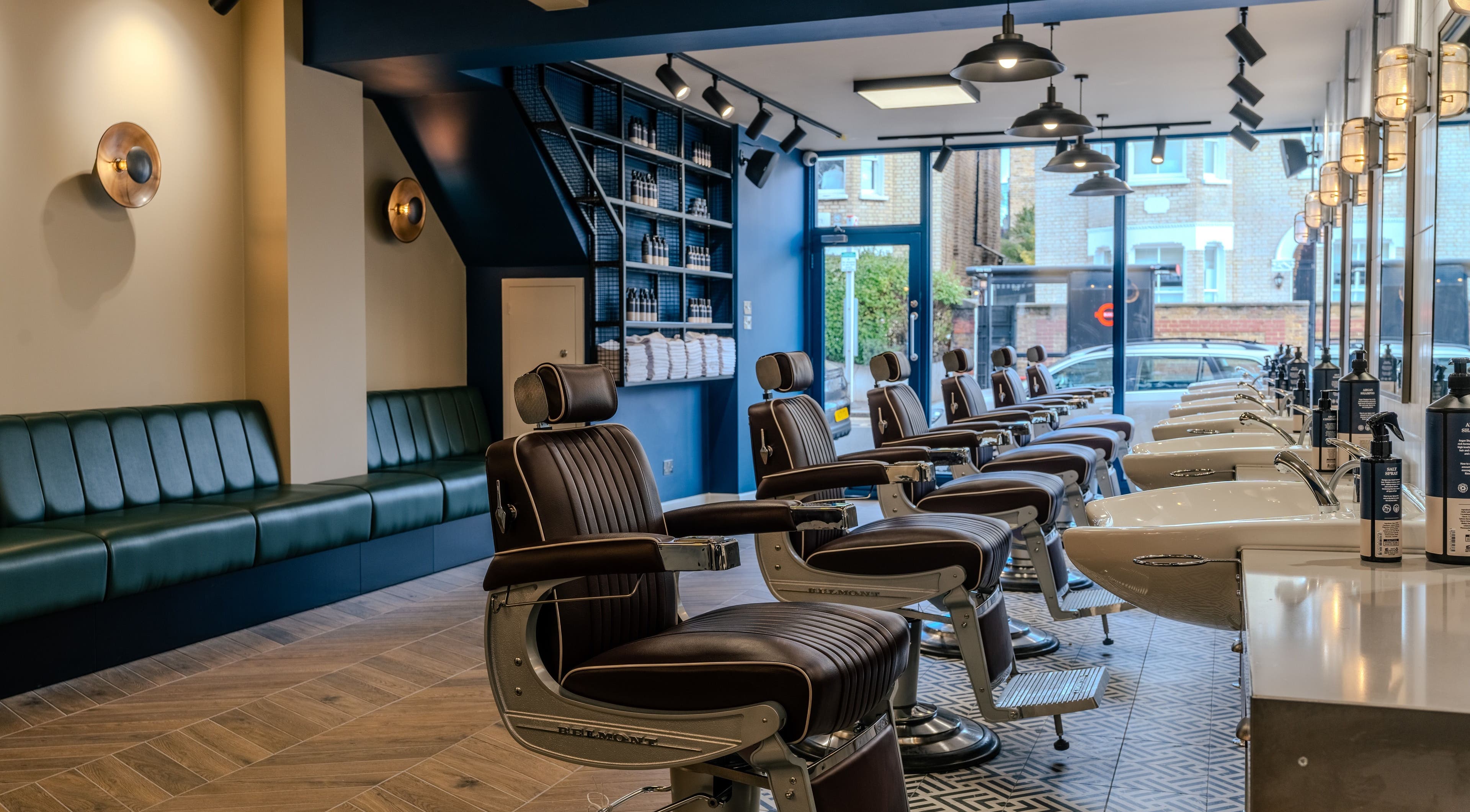 Modern barber chairs in Sammies Studio - Northcote Road, London, England, GB. Stylish and inviting ambience.