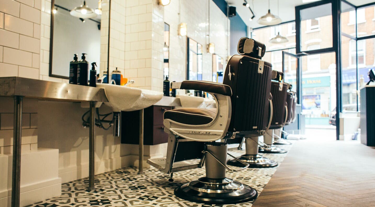 Elegant barber chairs at Sammies Studio - Fulham Road, London, England, GB showcasing modern interior.