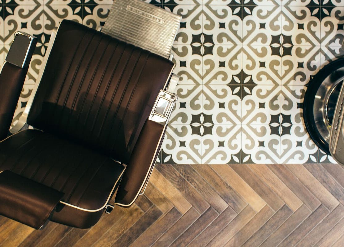 Elegant salon chair at Sammies Studio - Fulham Road, London, England, GB with stylish tiled floor.