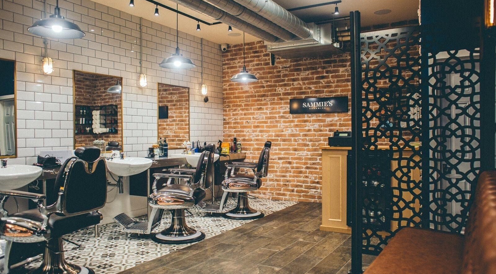 Modern salon interior at Sammies Studio - Worcester Park, London, England, GB featuring stylish chairs and decor.