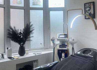 Modern spa room at Enhanced by Georgia, Tiptree, England, GB, featuring sleek equipment and soothing decor.
