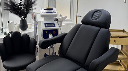 Luxury treatment room with black chair at Enhanced by Georgia, Tiptree, England, GB.