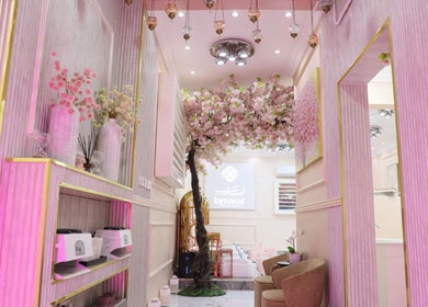 Elegant interior of Lamsat Magribyah Beauty Center in Doha, Al Rayyan Municipality, QA, featuring cherry blossom decor.