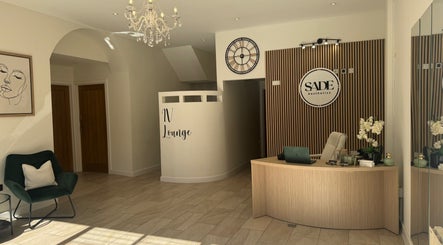 Elegant reception area at SADE Aesthetics Berkshire, Reading, England, GB, featuring modern decor and a welcoming desk.