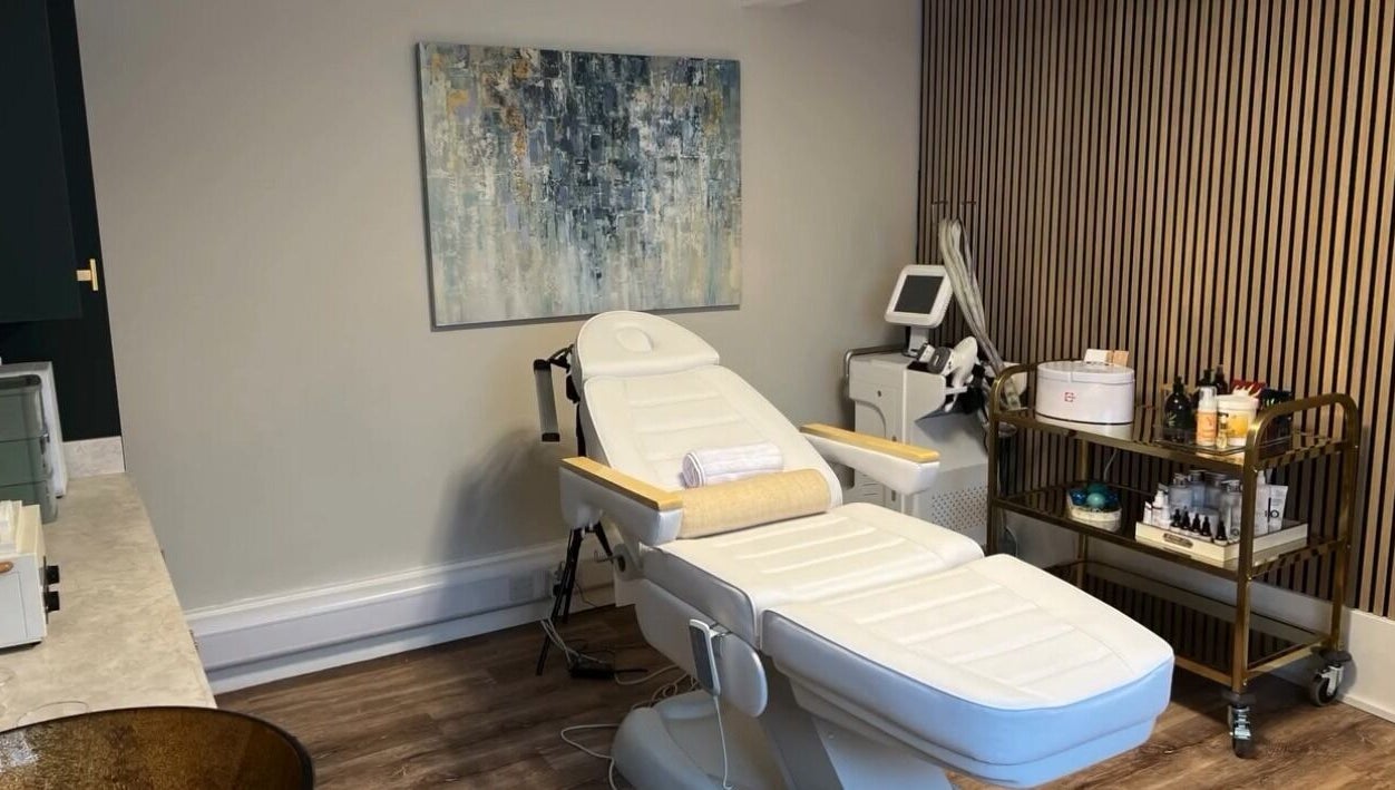Tranquil treatment room at NOVA Wellness Clinic, Lyndhurst, England, GB featuring equipment and decor.