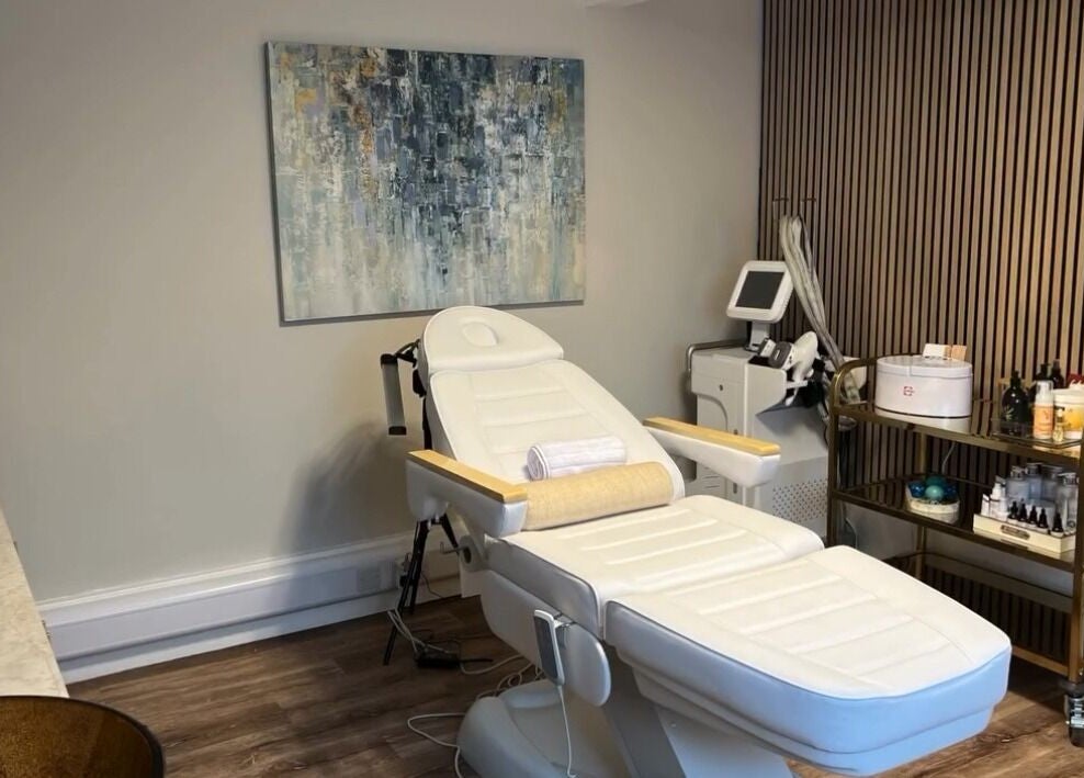 Tranquil treatment room at NOVA Wellness Clinic, Lyndhurst, England, GB featuring equipment and decor.