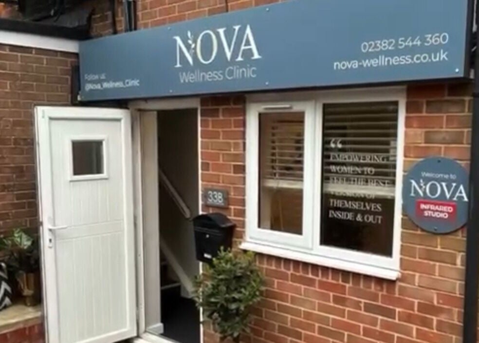 Front entrance of NOVA Wellness Clinic in Lyndhurst, England, GB showcasing modern design and welcoming sign.
