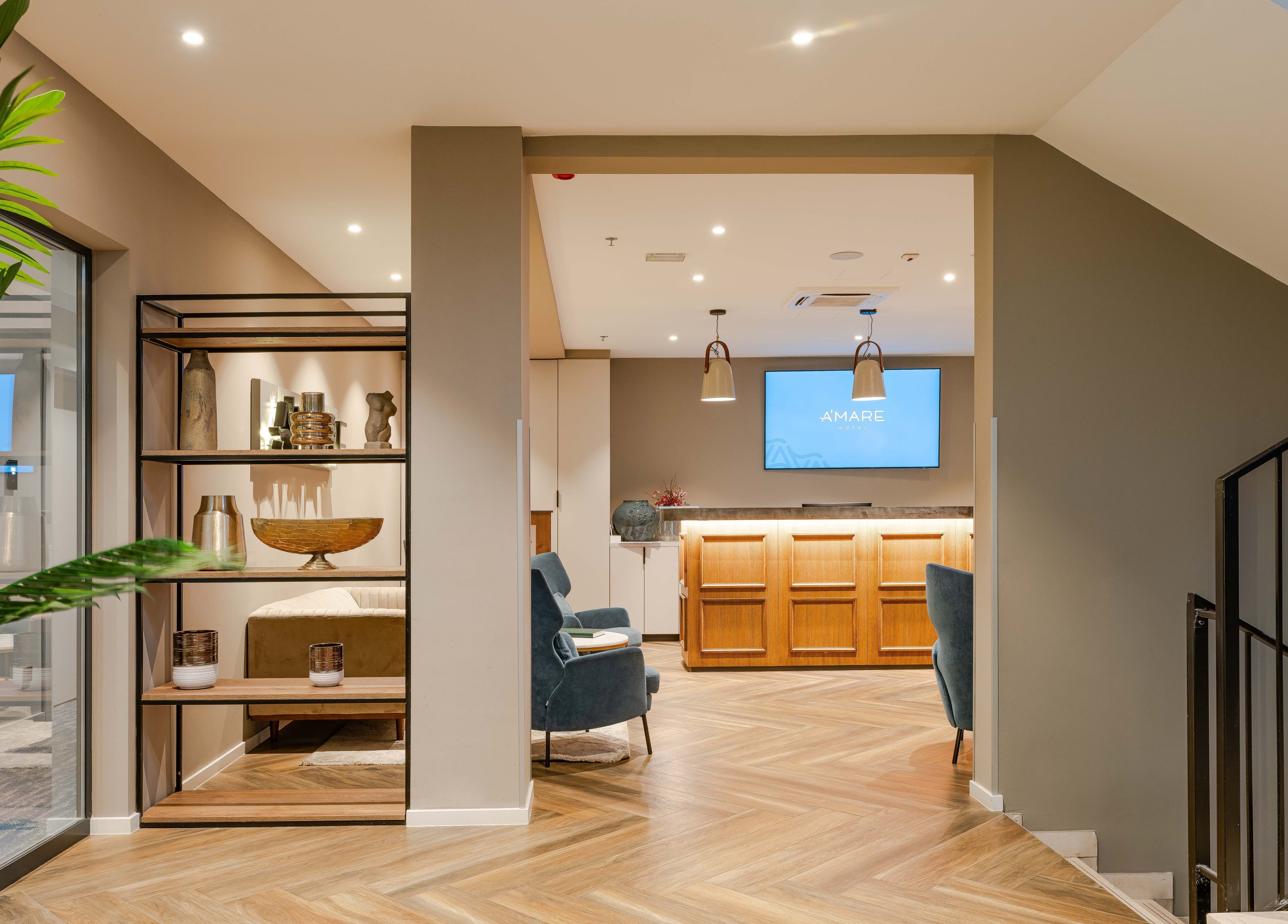 Elegant reception area of Hotel A'mare in Zadar, Zadarska Županija, HR, featuring stylish decor and seating.