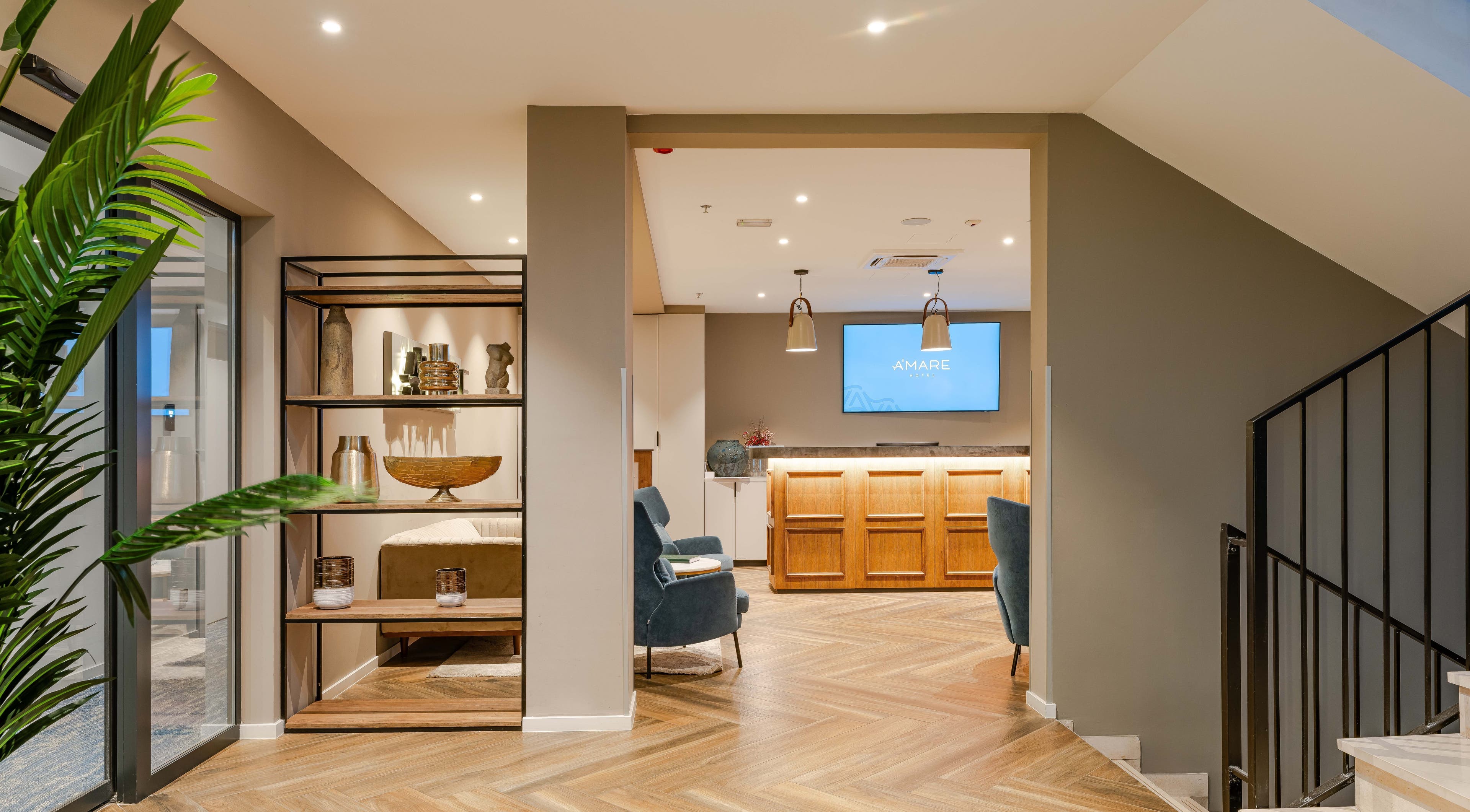Elegant reception area of Hotel A'mare in Zadar, Zadarska Županija, HR, featuring stylish decor and seating.