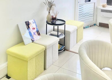 Stylish seating at King Nails, Hampton Wick, England, GB. Elegant decor enhances the welcoming ambiance.