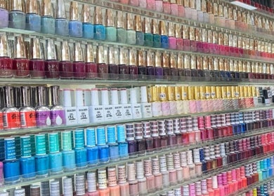Colorful nail polish selection at King Nails, Hampton Wick, England, GB, showcasing various shades.