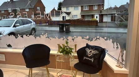 Inviting seating area inside Chelsie Jane Nails, Great Wyrley, England, GB featuring stylish chairs and decor.